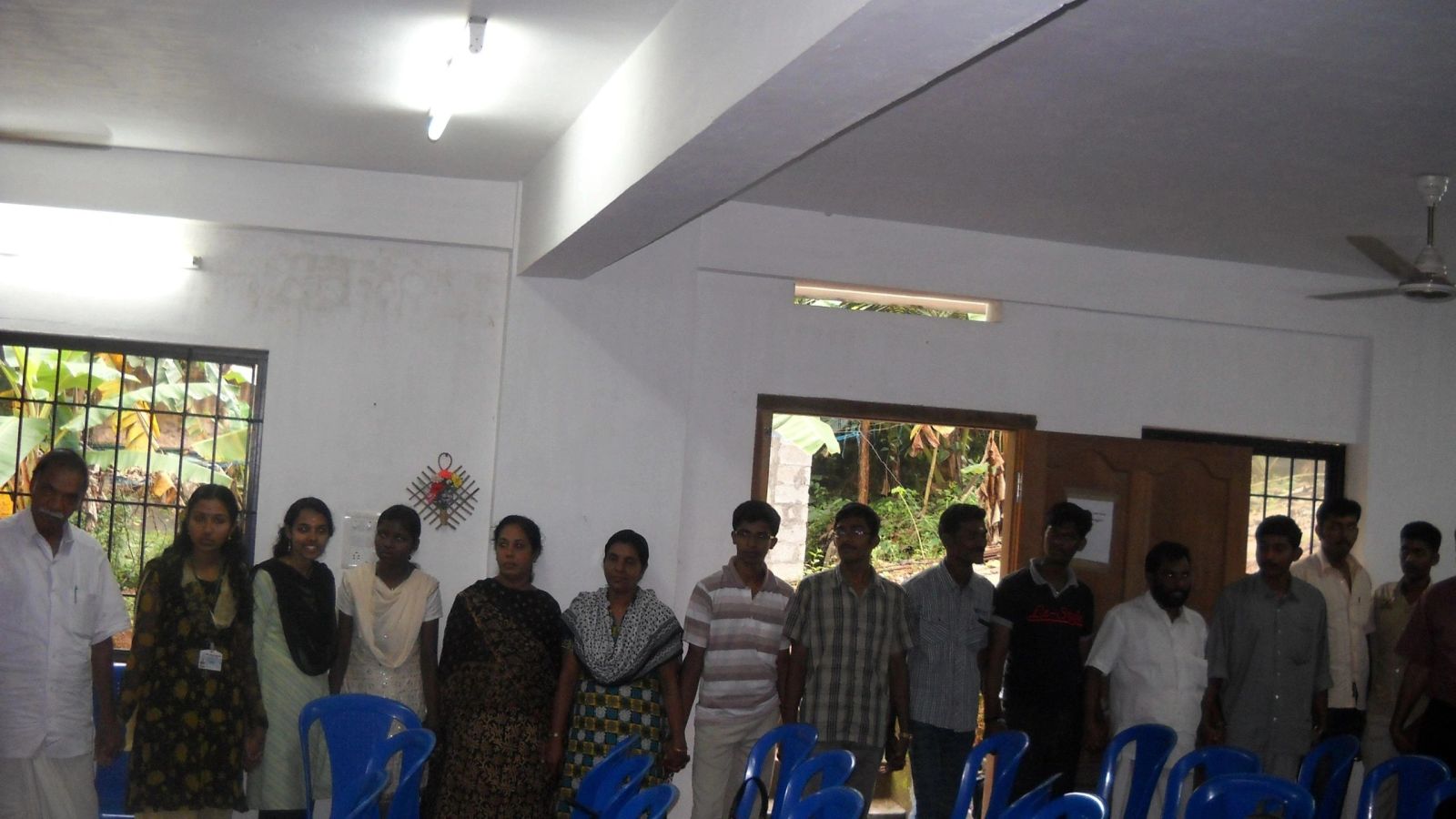 Volunteers standing together at a programme